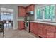 View of kitchen featuring granite countertops, cherry wood cabinets, and stainless steel appliances at 512 Saint Cloud Dr, Statesville, NC 28625