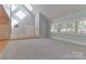 Light-filled living room with high ceilings, modern fixtures, and multiple windows at 512 Saint Cloud Dr, Statesville, NC 28625