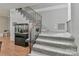 Staircase with carpeted steps, railing, and an aquarium at 512 Saint Cloud Dr, Statesville, NC 28625