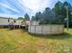 Home featuring a wooden deck and above-ground pool at 5318 Austin Rd, Monroe, NC 28112