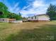 Home featuring an above-ground pool and wooden deck at 5318 Austin Rd, Monroe, NC 28112