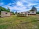 Backyard with an above-ground pool and storage shed at 5318 Austin Rd, Monroe, NC 28112