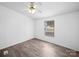 Cozy bedroom with light walls, stylish flooring, ceiling fan, and a window for natural light at 5318 Austin Rd, Monroe, NC 28112
