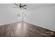 Bright bedroom with two windows allowing natural light, wood-look floors, and neutral colors at 5318 Austin Rd, Monroe, NC 28112
