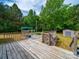 Home featuring a wooden deck overlooking the pool at 5318 Austin Rd, Monroe, NC 28112