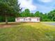 Single story home with lawn in a sunny, wooded setting at 5318 Austin Rd, Monroe, NC 28112