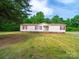 Charming single story home with red accents and green lawn at 5318 Austin Rd, Monroe, NC 28112