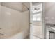 Bathroom with a shower and tub combination next to a granite topped vanity at 542 Goldstaff Ln, Charlotte, NC 28273