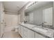 Bright bathroom featuring granite countertops and a shower-tub combo at 542 Goldstaff Ln, Charlotte, NC 28273