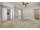 Spacious bedroom featuring gray walls and a walk-in closet at 542 Goldstaff Ln, Charlotte, NC 28273
