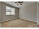 Cozy bedroom with carpet, a window, and plenty of natural light at 542 Goldstaff Ln, Charlotte, NC 28273