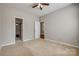 Spacious bedroom featuring neutral tones, a ceiling fan, and ample natural light at 542 Goldstaff Ln, Charlotte, NC 28273