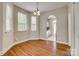 Dining room features hardwood floors, hanging chandelier, and natural light at 542 Goldstaff Ln, Charlotte, NC 28273