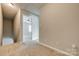 Upstairs hallway with carpeted floors, leading to bedrooms at 542 Goldstaff Ln, Charlotte, NC 28273