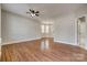 Spacious living room with natural light, hard surface flooring, and neutral walls at 542 Goldstaff Ln, Charlotte, NC 28273