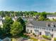 Exterior view of a charming townhouse featuring well-maintained landscaping and a welcoming entrance at 542 Goldstaff Ln, Charlotte, NC 28273