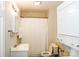 Bathroom featuring a shower, toilet, vanity with sink, and a stackable washer dryer at 602 Childs St, Lincolnton, NC 28092