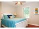 Relaxing bedroom featuring a queen-sized bed with a white headboard and bright blue comforter at 602 Childs St, Lincolnton, NC 28092