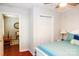 Bright bedroom shows bed, floors, closet, and open doorway leading to living room at 602 Childs St, Lincolnton, NC 28092