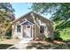 Charming single-story home featuring tan siding, white trim and a cozy covered entrance at 602 Childs St, Lincolnton, NC 28092