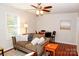 Comfortable living room features wood floors, ceiling fan, and sofa with decorative pillows at 602 Childs St, Lincolnton, NC 28092