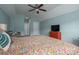 Spacious bedroom with a ceiling fan, seating area, and a bright red dresser for storage and style at 6029 Bountiful St, Belmont, NC 28012