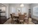 Dining room features a round table, chandelier lighting, and an open entrance to another room at 6029 Bountiful St, Belmont, NC 28012