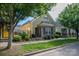 Charming home featuring a combination of stone and shingle siding, complemented by manicured landscaping at 6029 Bountiful St, Belmont, NC 28012