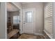 Welcoming foyer with a decorative glass door and hardwood floors, adjacent to a dining and living area at 6029 Bountiful St, Belmont, NC 28012