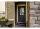 Inviting entrance with a decorative door, stone facade and potted plants enhancing the curb appeal at 6029 Bountiful St, Belmont, NC 28012
