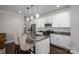 Contemporary kitchen with granite countertops, stainless appliances, island with seating at 6029 Bountiful St, Belmont, NC 28012