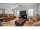 Bright living room features hardwood floors, neutral walls, and comfortable seating at 6029 Bountiful St, Belmont, NC 28012