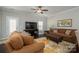 Inviting living room with hardwood floors, comfortable seating, and a ceiling fan at 6029 Bountiful St, Belmont, NC 28012