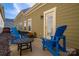 Inviting patio with comfortable blue Adirondack chairs and outdoor furniture, perfect for relaxation at 6029 Bountiful St, Belmont, NC 28012