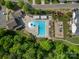 Aerial view of a community pool, playground, and surrounding greenery, providing a recreational space at 6029 Bountiful St, Belmont, NC 28012