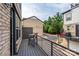 Private balcony with outdoor seating and neighborhood views at 604 Tudor Park Way, Charlotte, NC 28211