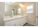 Bathroom featuring double sink vanity with quartz countertop and modern fixtures at 604 Tudor Park Way, Charlotte, NC 28211