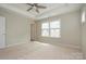 Bright bedroom with large windows and plush carpeting at 604 Tudor Park Way, Charlotte, NC 28211