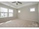 Spacious bedroom featuring plush carpeting and natural light at 604 Tudor Park Way, Charlotte, NC 28211