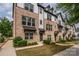 Charming townhomes featuring brick and siding accents, landscaped yards, and inviting curb appeal at 604 Tudor Park Way, Charlotte, NC 28211
