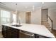 Bright kitchen featuring quartz countertops, stainless steel appliances, and wood flooring at 604 Tudor Park Way, Charlotte, NC 28211