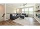 Bright living room with large sectional sofa, wood floors, and a cozy fireplace, perfect for relaxing at 604 Tudor Park Way, Charlotte, NC 28211