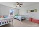 Bright bedroom with two twin beds, a window, and posters on the walls at 6159 Holland St, Fort Mill, SC 29707