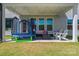 Inviting covered patio with outdoor seating, trampoline, and string lights at 6159 Holland St, Fort Mill, SC 29707