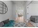 Bright hallway with wood floors, decorative mirror and entry to the living area at 6159 Holland St, Fort Mill, SC 29707