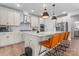 Contemporary kitchen with large island, pendant lights, stainless steel appliances, and stone countertops at 6159 Holland St, Fort Mill, SC 29707