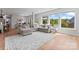 Spacious living room featuring a sectional sofa, large windows, and an open layout at 6159 Holland St, Fort Mill, SC 29707