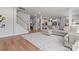 Open living room featuring a comfortable sectional sofa and wood flooring at 6159 Holland St, Fort Mill, SC 29707