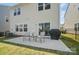 Backyard patio with table, chairs and grill, perfect for outdoor entertaining and relaxation at 637 Scotch Meadows Loop, Monroe, NC 28110