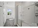 Bright bathroom featuring a glass-enclosed shower and natural light at 637 Scotch Meadows Loop, Monroe, NC 28110
